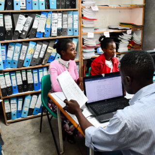 Yawezekana Sacco staff at the site office